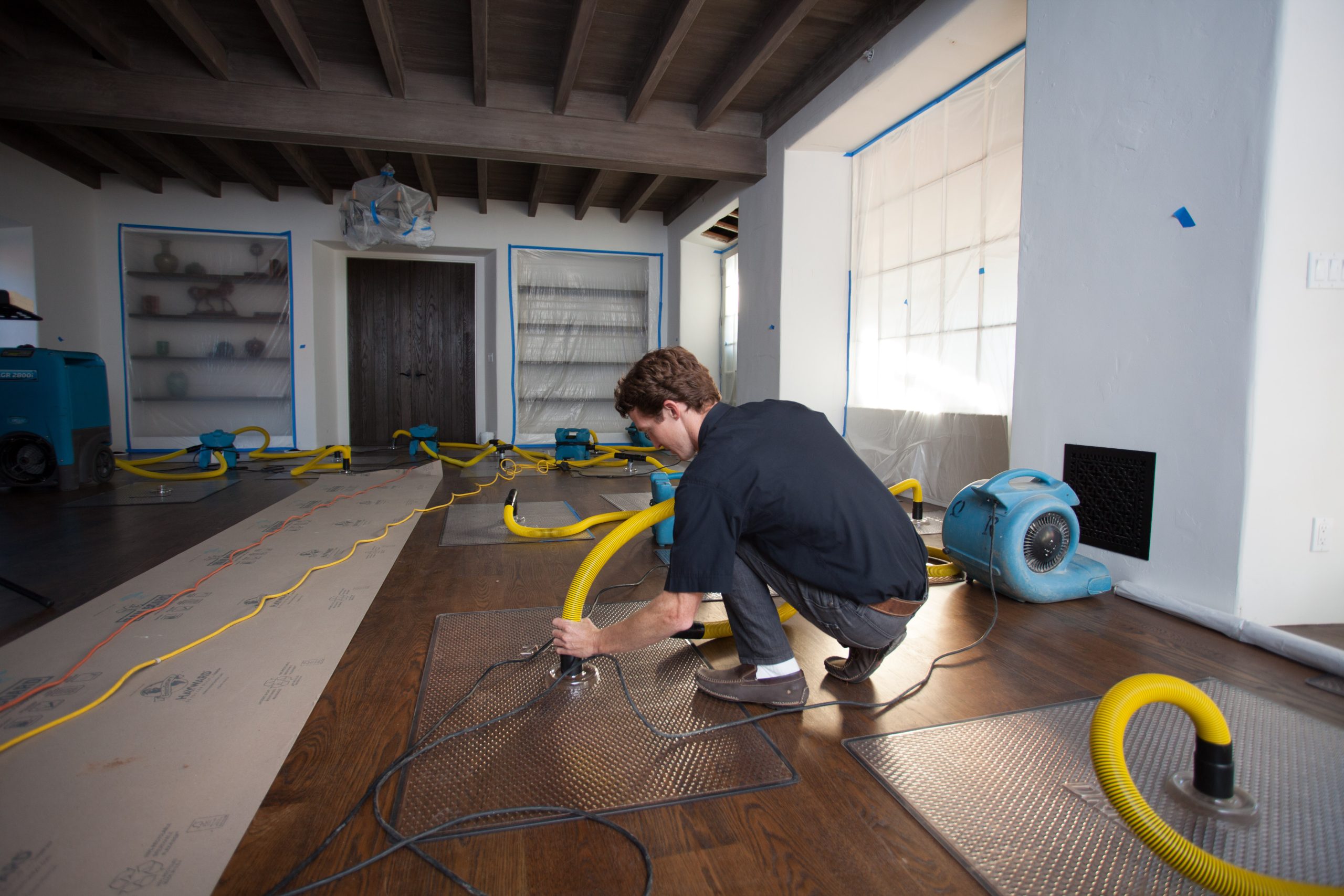 Water damage restoration company performing indoor water extraction services